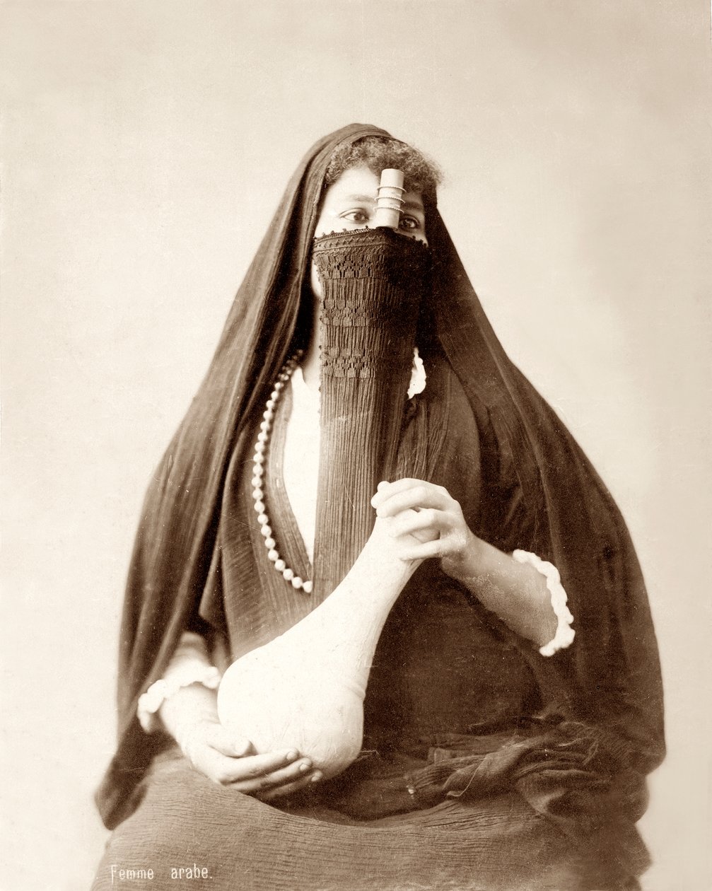 Pige med hovedbeklædning og krukke i hånden, ca.1867-98 af Bonfils Studio