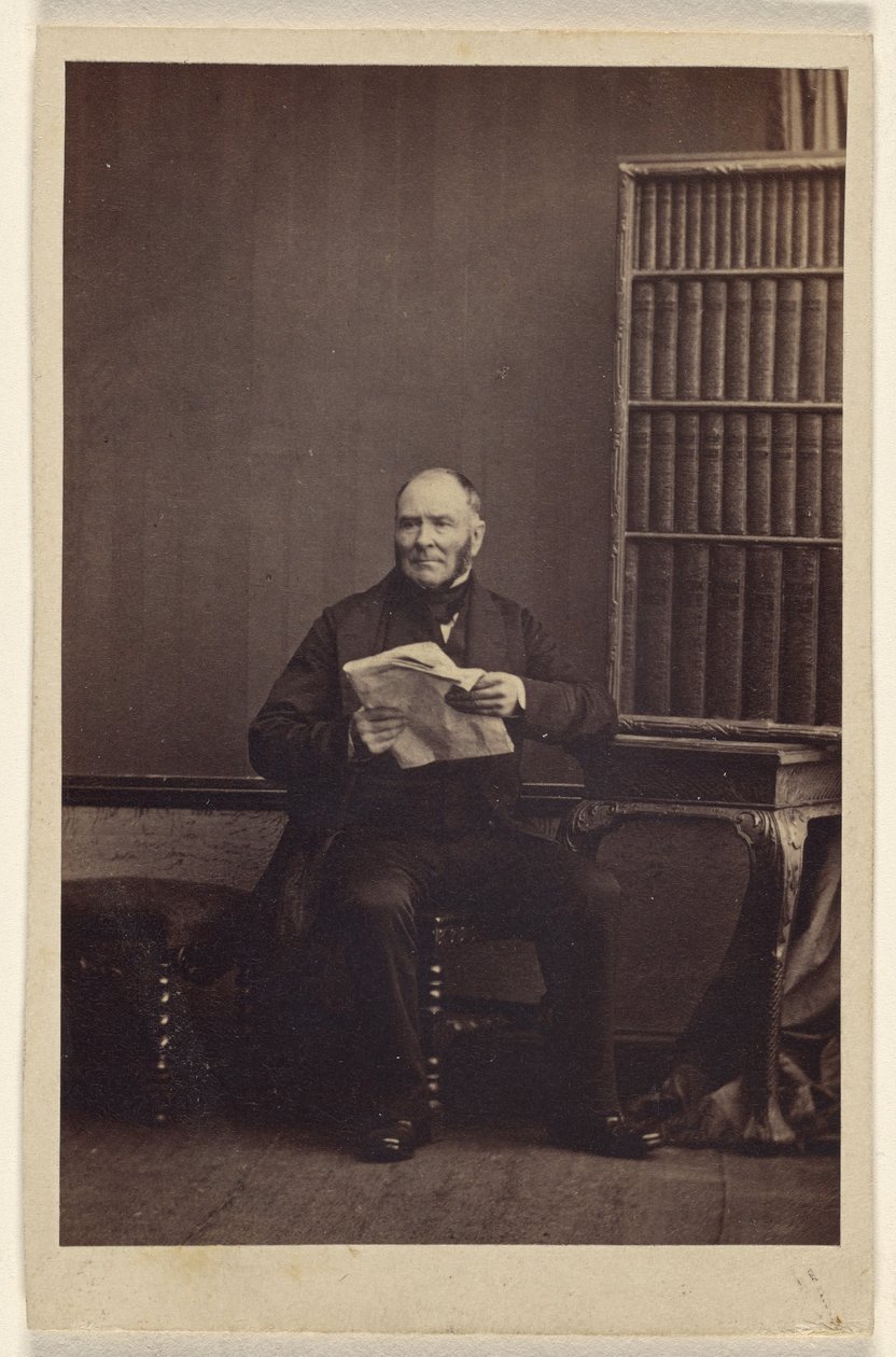 [Uidentificeret mand sidder med en avis i hånden]. af Camille Silvy