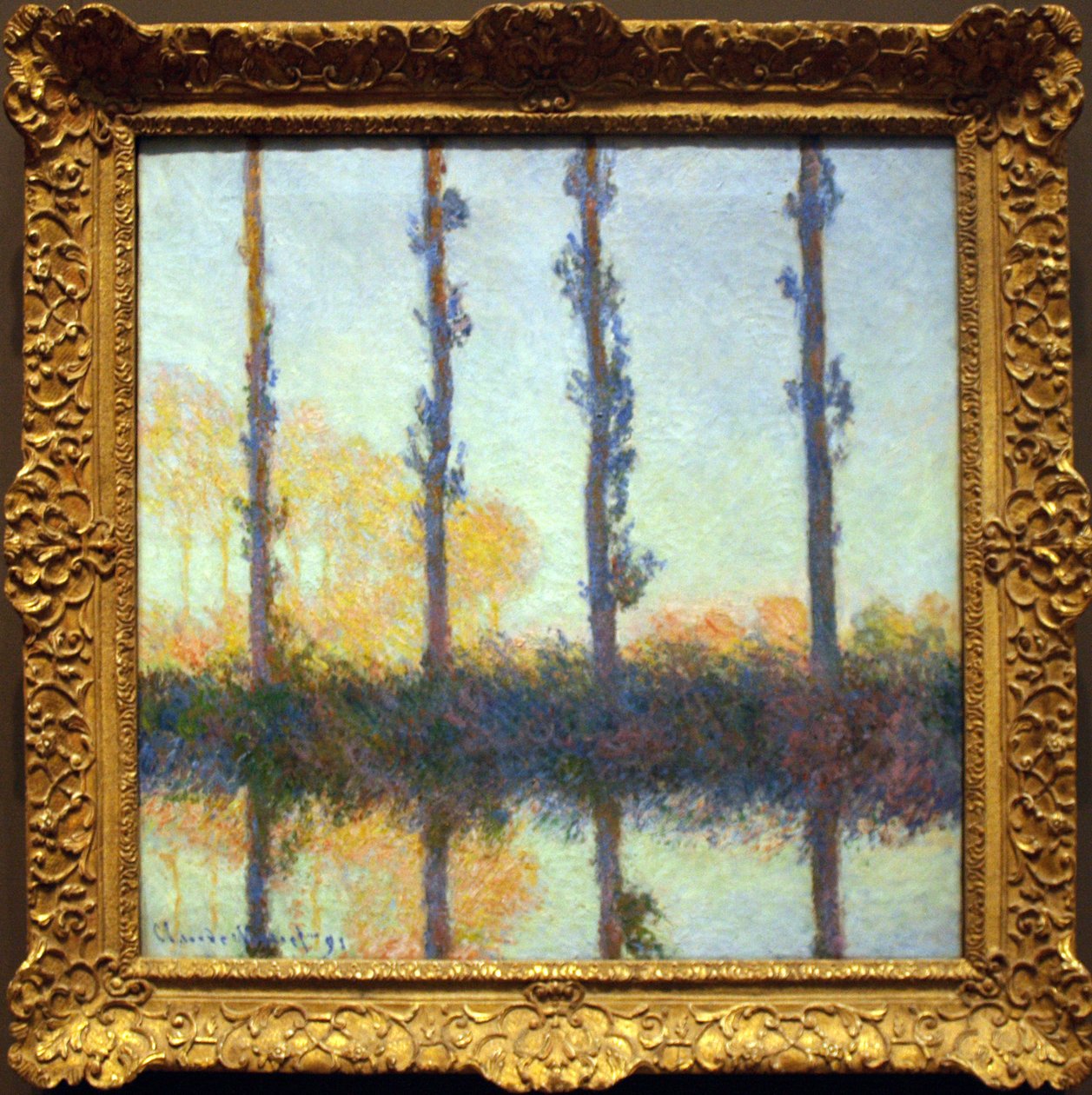 De fire træer af Claude Monet