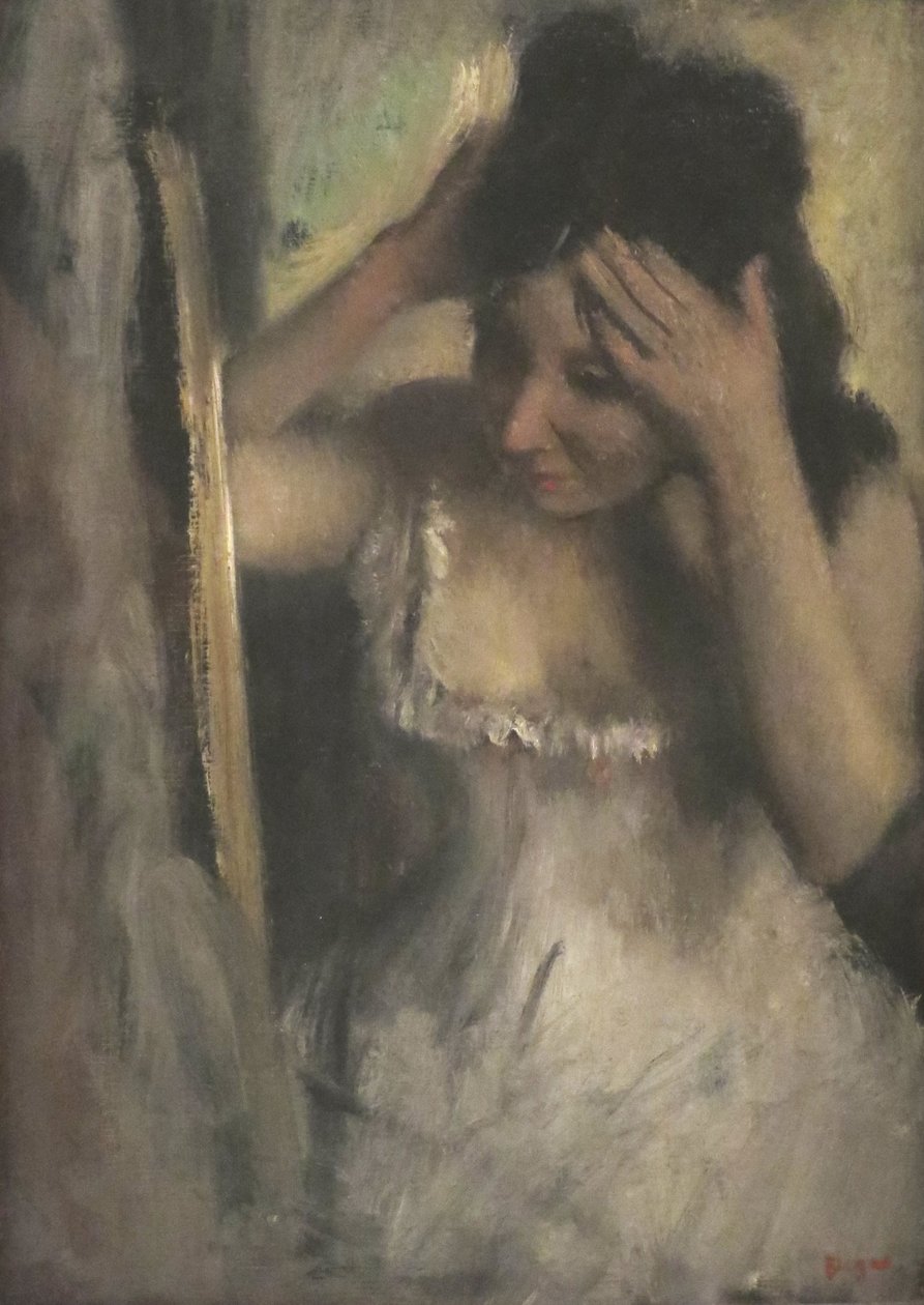 Kvinde kæmmer sit hår før et spejl af Edgar Degas