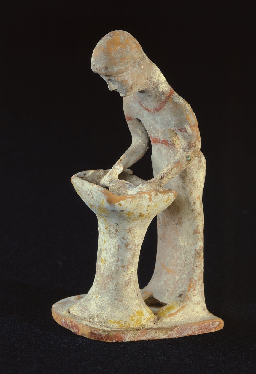 Statuette af en kvinde, der ruller wienerbrød, fra Tanagra, Boeotia (ler) af Greek