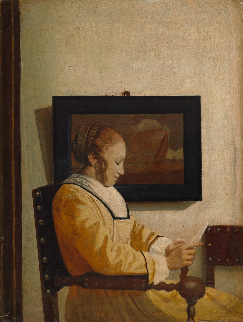 En ung kvinde læser. af Imitator of Johannes Vermeer