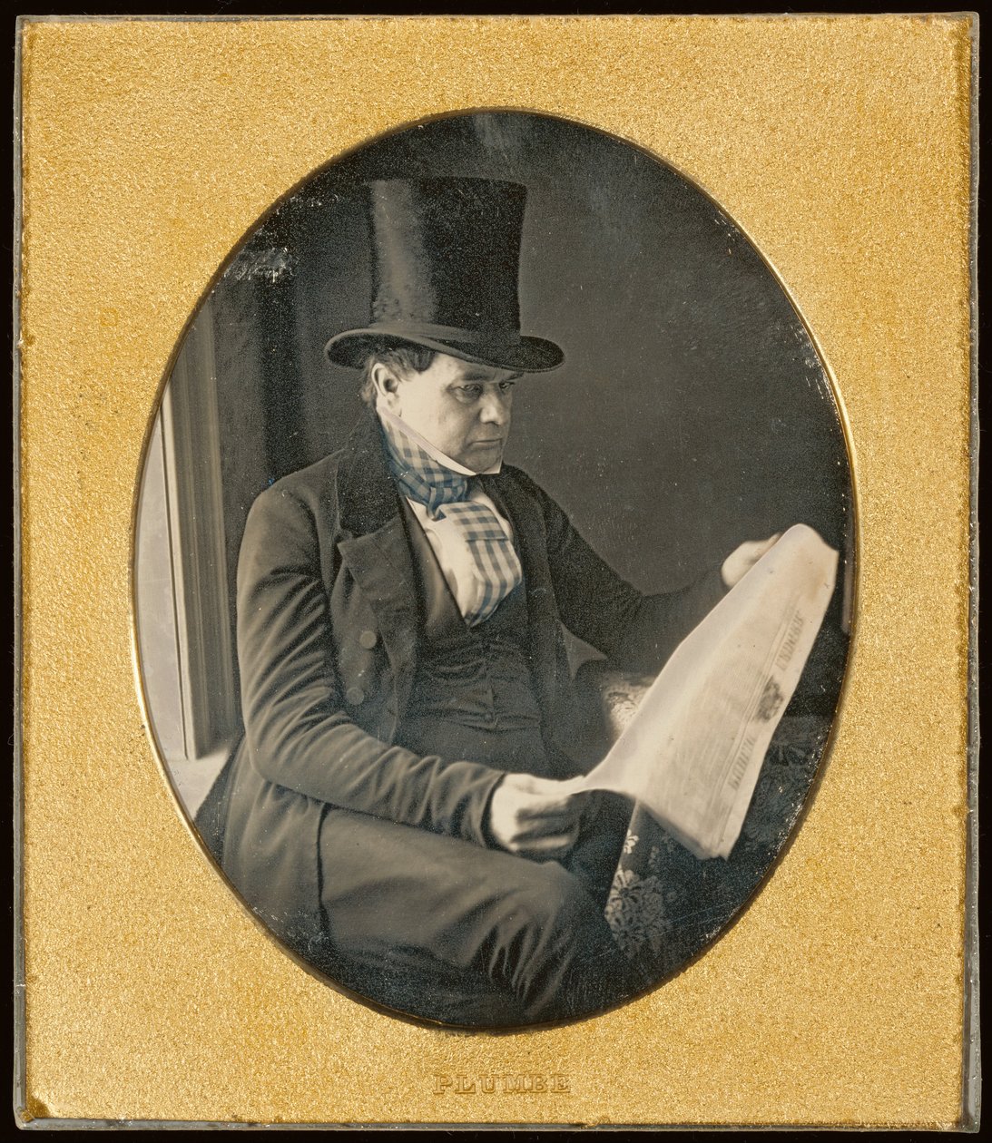 Mand læser en avis af John Plumbe Jr.