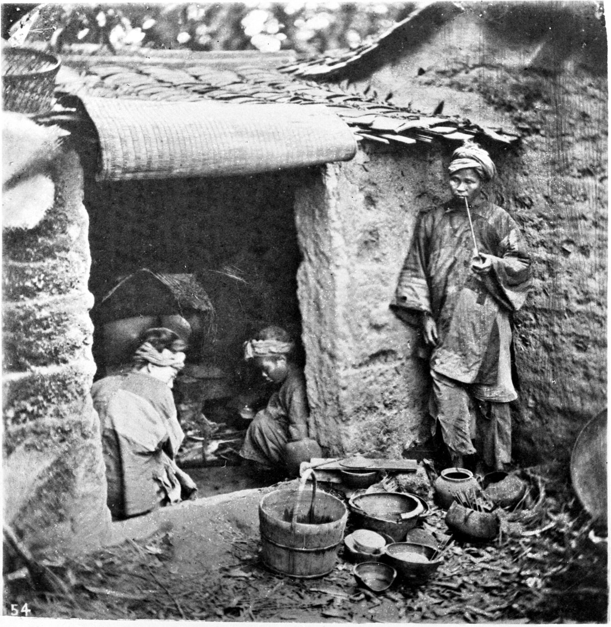 Kina, en simpel familie, ca. 1870 (foto) af John Thomson