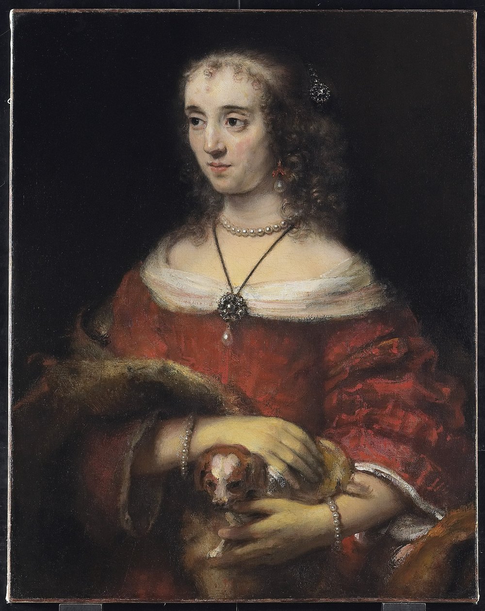 Portræt af en dame med en skødehund, ca. 1665 af Rembrandt van Rijn