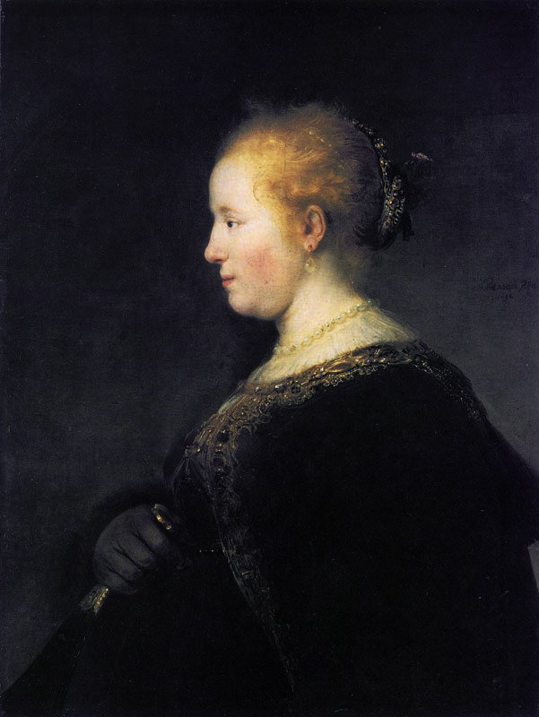 En ung kvinde i profil med en vifte af Rembrandt van Rijn