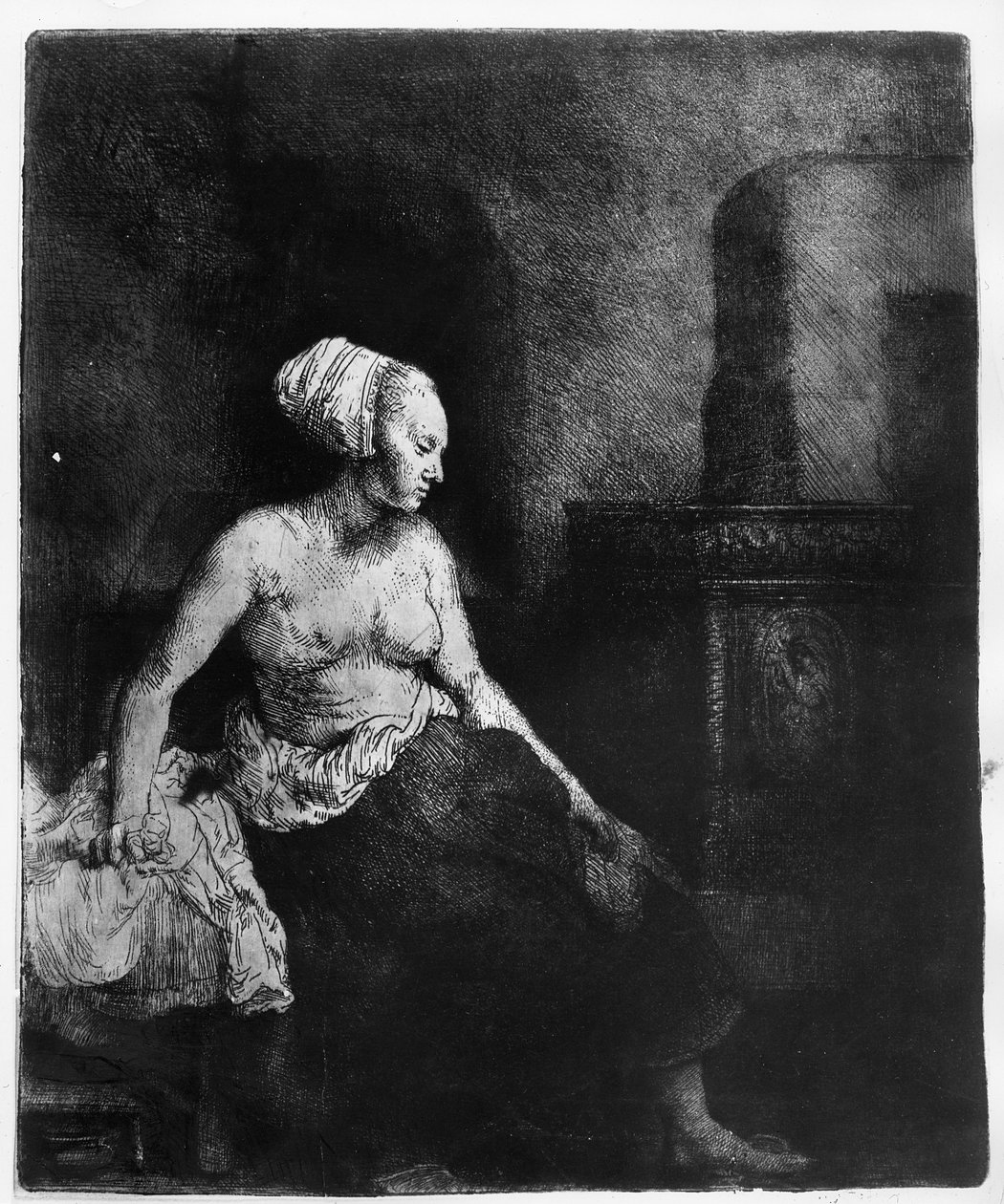 Kvinde siddende halvt påklædt ved siden af en brændeovn, 1658 af Rembrandt van Rijn