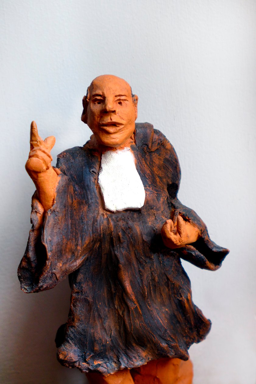 Advokat i kjole, bønfald, 20. århundrede (skulptur) af Robert Bousquet