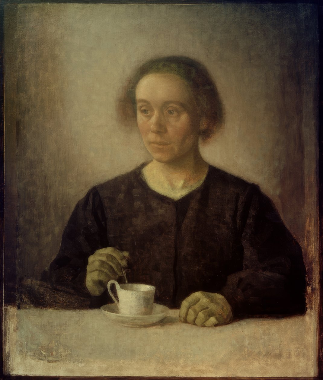 Kunstnerens kone med tekop af Vilhelm Hammershoi