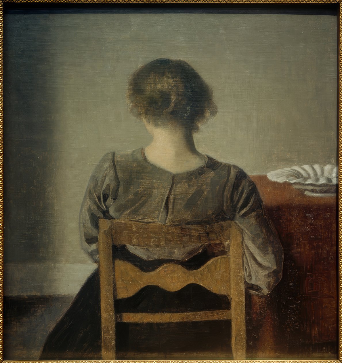 Ung kvinde. Hvilepause af Vilhelm Hammershoi