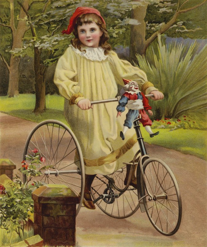 Pige kører på sin trehjulede cykel i haven af English School